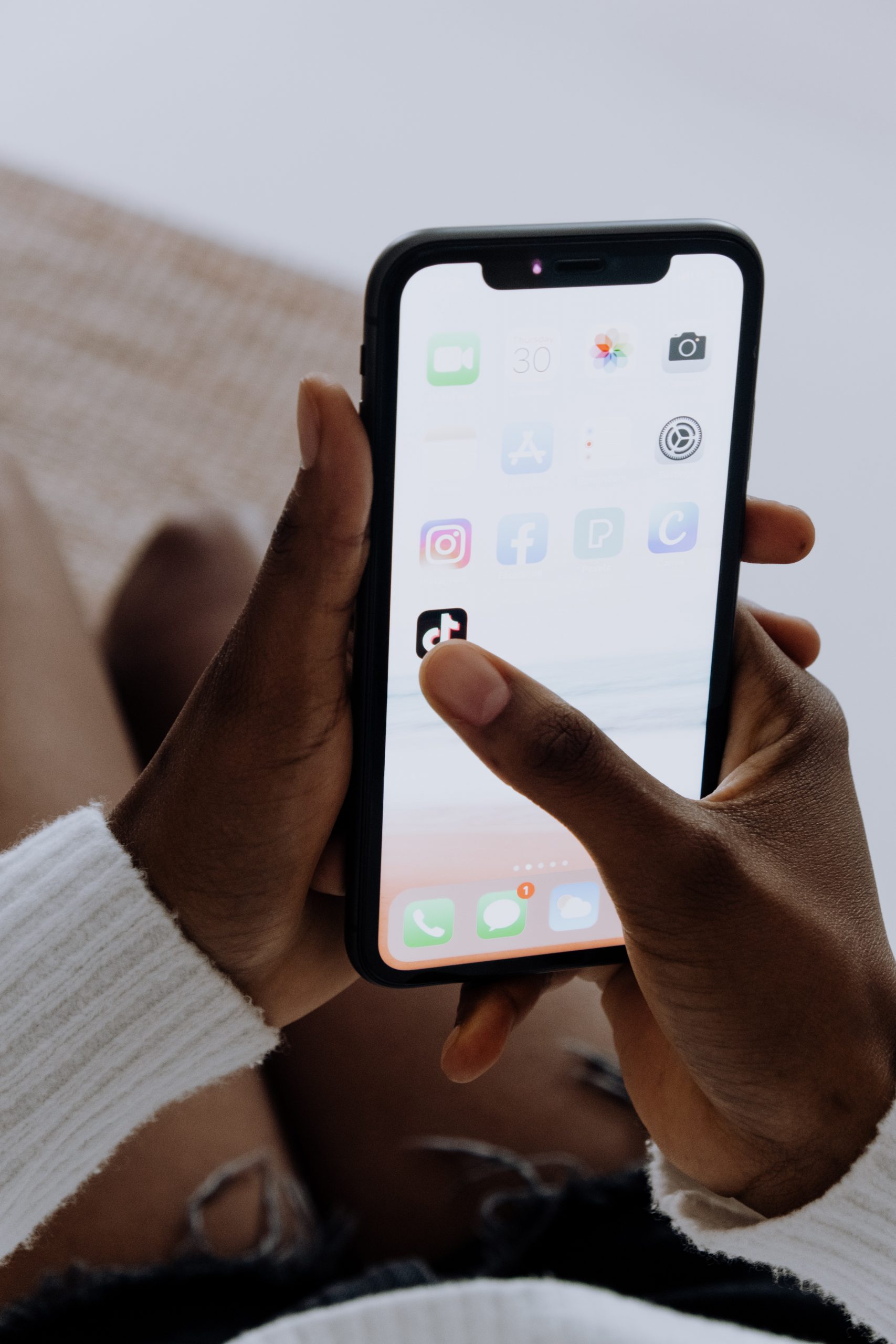 TikTok ads strategy displayed on a smartphone with the TikTok app open